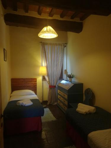 Ένα ή περισσότερα κρεβάτια σε δωμάτιο στο Agriturismo Sant'illuminato