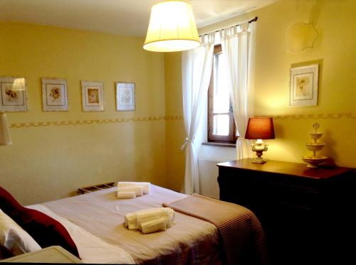 Ένα ή περισσότερα κρεβάτια σε δωμάτιο στο Agriturismo Sant'illuminato