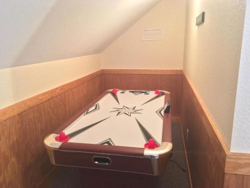 a clock in a box in the corner of a room at Cherry Blossom by Eden Crest in Pigeon Forge