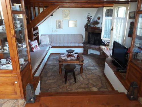 a living room with a couch and a table at Elies Apartments in Alinda