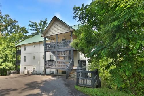 a large white building with a staircase leading up to it at Pinnacle View 7A by Eden Crest in Pigeon Forge