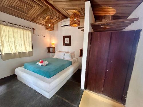 a bedroom with a bed in a room at Pousada Maresia in Atins