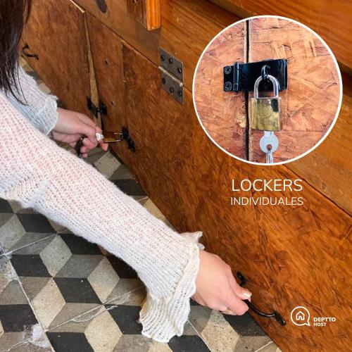 a woman is unlocking a door with a lightswitch at HOSTEL COLIVING STUDIO JUNIN in Junín