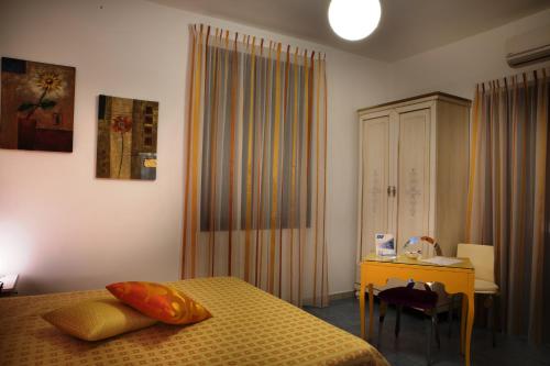 Postel nebo postele na pokoji v ubytování B&B Il Mandorlo