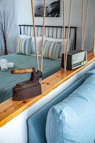 a swing in a bedroom with two beds at Lalaros Apartment in Glossa