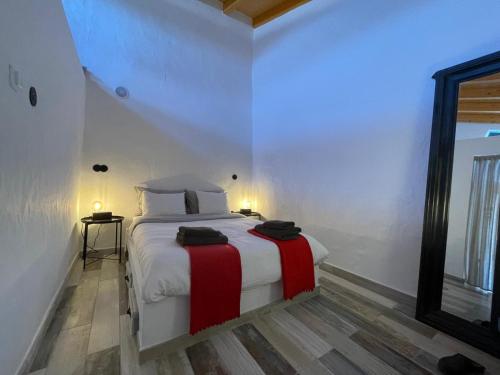 En eller flere senge i et værelse på Casa da Figueira - Guest House