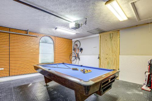 a room with a pool table in it at Port St Lucie Canal-Front Home with Heated Pool! in Port Saint Lucie