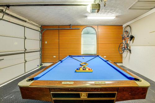 a garage with a pool table in a room at Port St Lucie Canal-Front Home with Heated Pool! in Port Saint Lucie