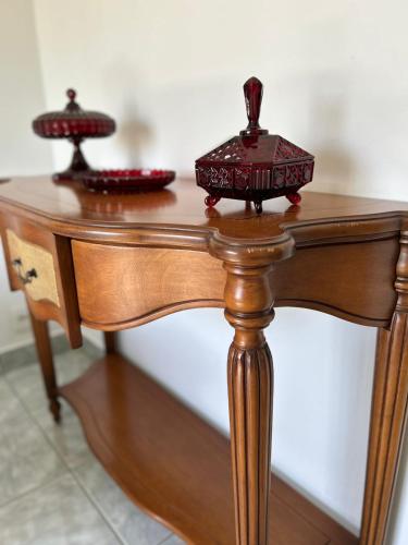 a wooden table with two lamps on top of it at Italian Palace Hotel in Sinop