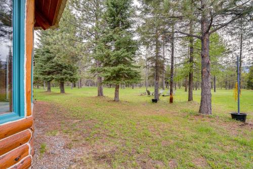a view of a park with trees and a bench at Peaceful Donnelly Retreat Less Than 1 Mi to Lake Cascade! in Donnelly