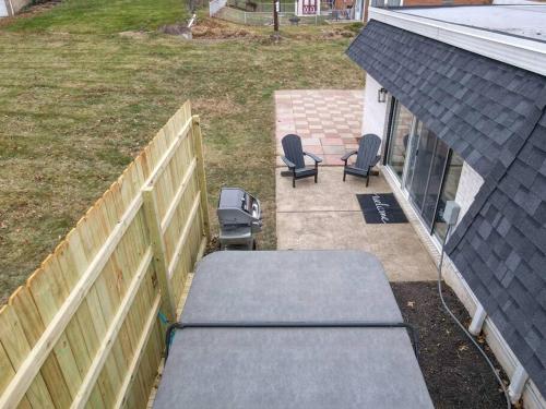 an aerial view of a backyard with two chairs and a fence at Game Day Getaway-Play Relax Make Memories in Canton