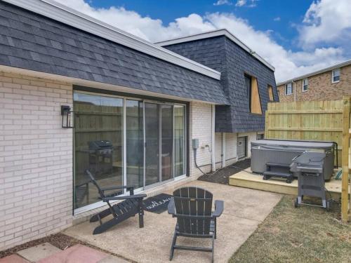 a screened in patio with a grill and a bbq grill at Game Day Getaway-Play Relax Make Memories in Canton