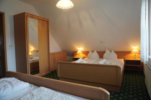 Katil atau katil-katil dalam bilik di Alcor Hotel Feriendorf an der Ostsee
