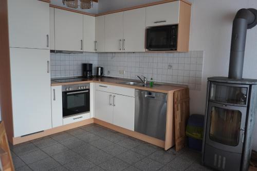 Dapur atau dapur kecil di Alcor Hotel Feriendorf an der Ostsee