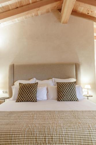 Ein Bett oder Betten in einem Zimmer der Unterkunft Hotel Castell de Vallgornera