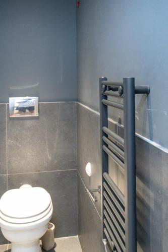 a bathroom with a white toilet in a room at Bellavista Kamarina Resort in Scoglitti
