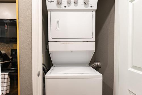 a white washer and dryer in a closet at Walk-in - Pools Galore - Gated Community - Golf On-Site - FREE TICKETS INCLUDED - HHK-7 in Branson