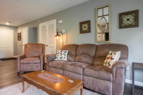a living room with a couch and a chair at Walk-in - Pools Galore - Gated Community - Golf On-Site - FREE TICKETS INCLUDED - HHK-7 in Branson