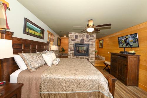 a bedroom with a bed and a fireplace at A Breath of Fresh Air by Eden Crest in Gatlinburg