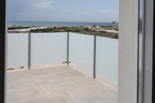 a view from the balcony of a building at Bellavista Kamarina Resort in Scoglitti
