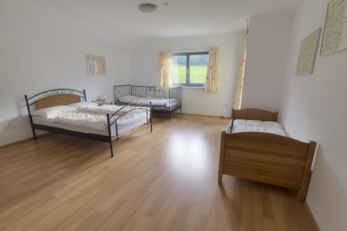 a living room with two beds and a couch at Haus Johendre in Rennweg