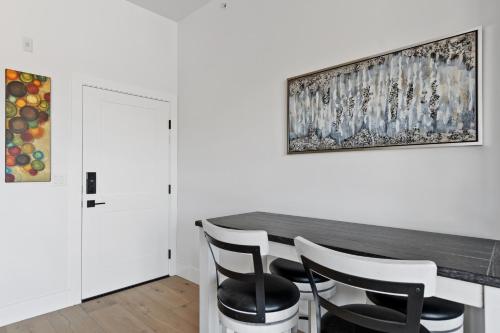 a dining room with a table and chairs at Alpenglow Retreat in Whitefish