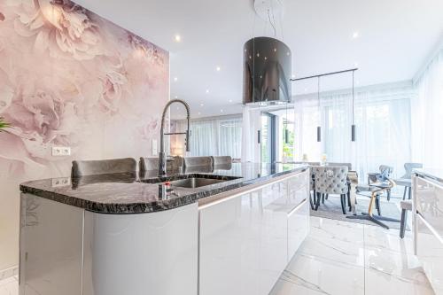 a kitchen with a sink and a counter at Luxury Vienna 6BR Villa with Private Pool & Sauna - Pets allowed in Vienna