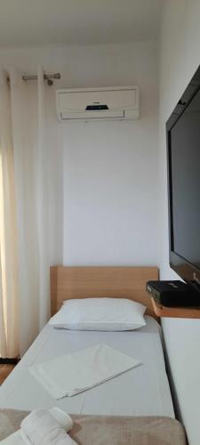 Llit o llits en una habitació de Vila Jone