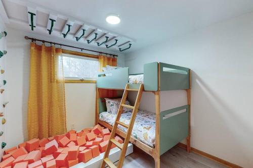 a bedroom with two bunk beds and a window at Gridiron Getaway-Where Families and Fans Unite in Canton