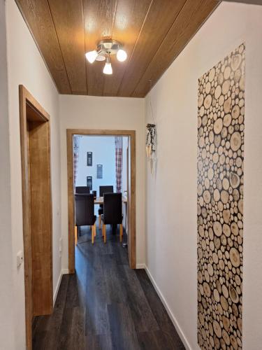 a hallway with a dining room in a house at Wohlfühlen am Waldrand in Thurmansbang