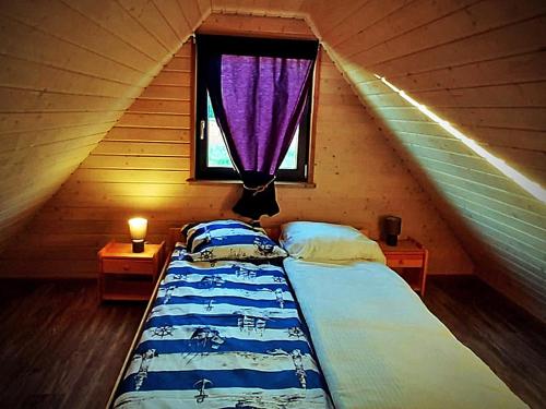 Postel nebo postele na pokoji v ubytování Jaśminowa Przystań