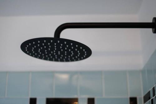 a black spatula on top of a counter at End Zone Escape-Light and Bright HOF Village Home in Canton