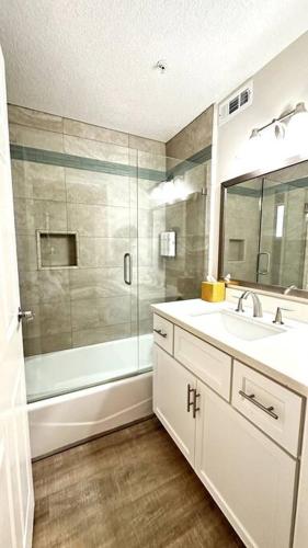 a bathroom with a shower and a sink and a mirror at Condo in Seascape Beach Resort in Aptos