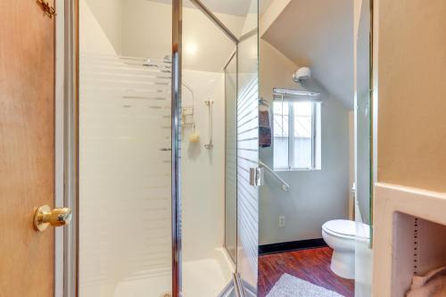 a bathroom with a shower and a toilet at Auburn Cottage with Patios and Garden - 3 Mi to Town! in Auburn
