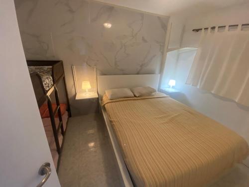 מיטה או מיטות בחדר ב-residence los molinos