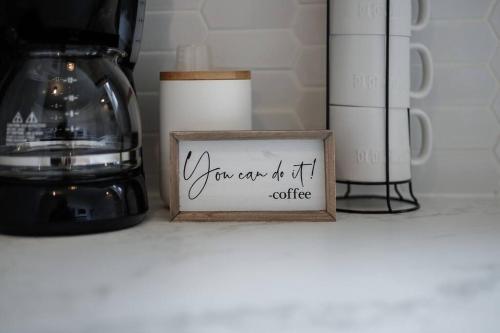 a sign that says you can do it coffee on a shelf at The Perfect Pass-HOF Village Escape in Canton
