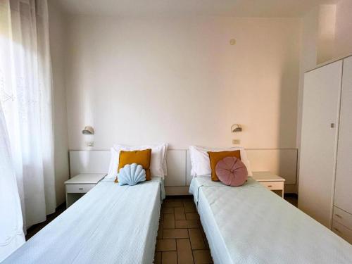 Postel nebo postele na pokoji v ubytování APPARTAMENTO -C- VISTA MARE con 2 camere da letto-Residence Azzurro