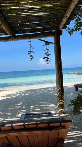 a view of the beach from a beach shack at Tintipan Cabana SalSiPuedes in Tintipan Island