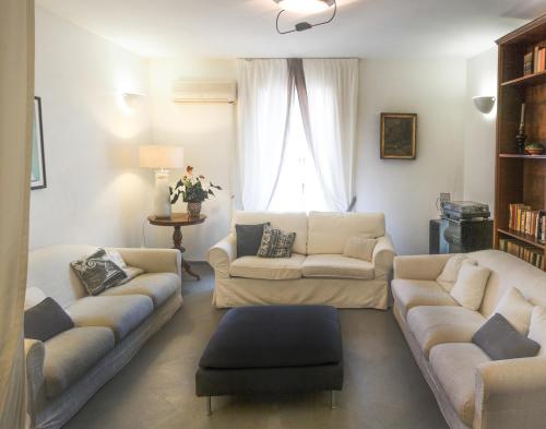 a living room with two couches and a window at Palazzo Spagna in Siracusa