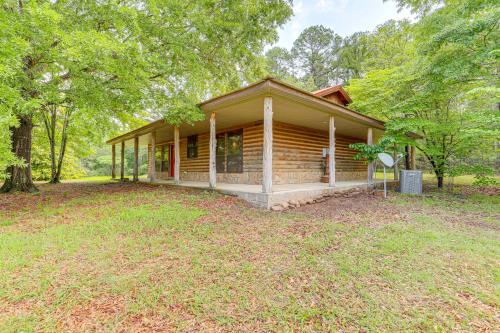 a house with a large yard in front of it at Tumbling Shoals Cabin Less Than 1 Mi to Beaches and Boating! in Heber Springs