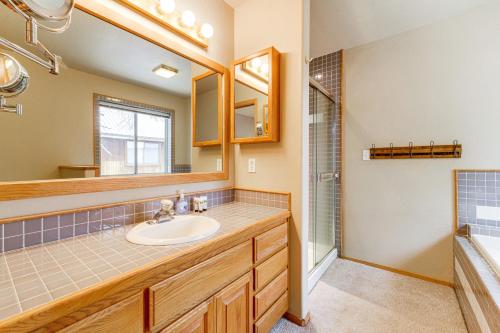 a bathroom with a sink and a mirror at Home with Deck and Access to Tahoe Donner Amenities! in Truckee