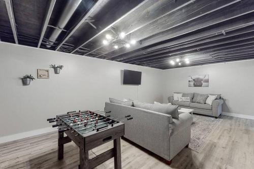 a living room with a couch and a chess board on a table at Some Kind of Wonderful-Escape Near Seneca Lake in Senecaville