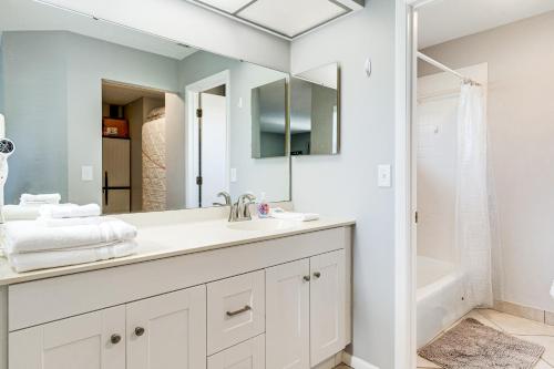 a bathroom with a sink and a mirror at Sarasota Villa with Pool Access about 4 Mi to Beach! in Sarasota