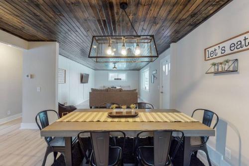 a dining room with a table and chairs at Steps to the HOF-Football Fans Dream Stay in Canton