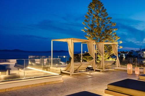 a christmas tree on the roof of a house at Grace Mykonos in Agios Stefanos