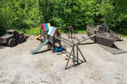 a group of playground equipment in a park at Grace and Grandeur-The Stables Estate in North Lawrence