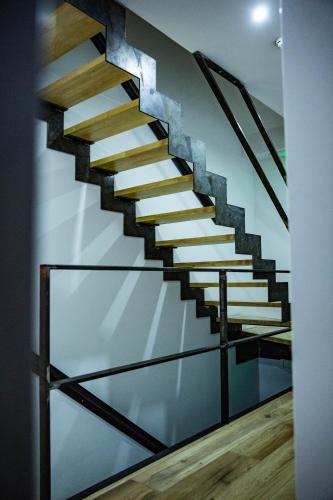 a staircase in a house with a glass wall at La villa M in Sart-lez-Spa