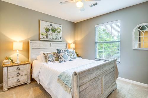 a bedroom with a large bed and a window at Home Sweet Home with Private Pool and Patio! in Knoxville