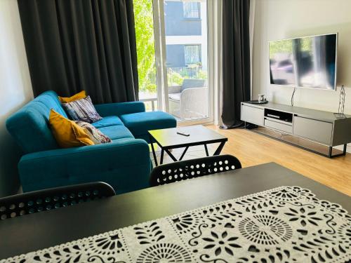 TV a/nebo společenská místnost v ubytování Apartament Sosnowy Zakątek