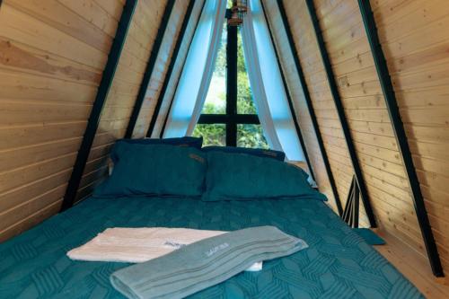 a bed in a room with a window at Paradise Keda in Keda
